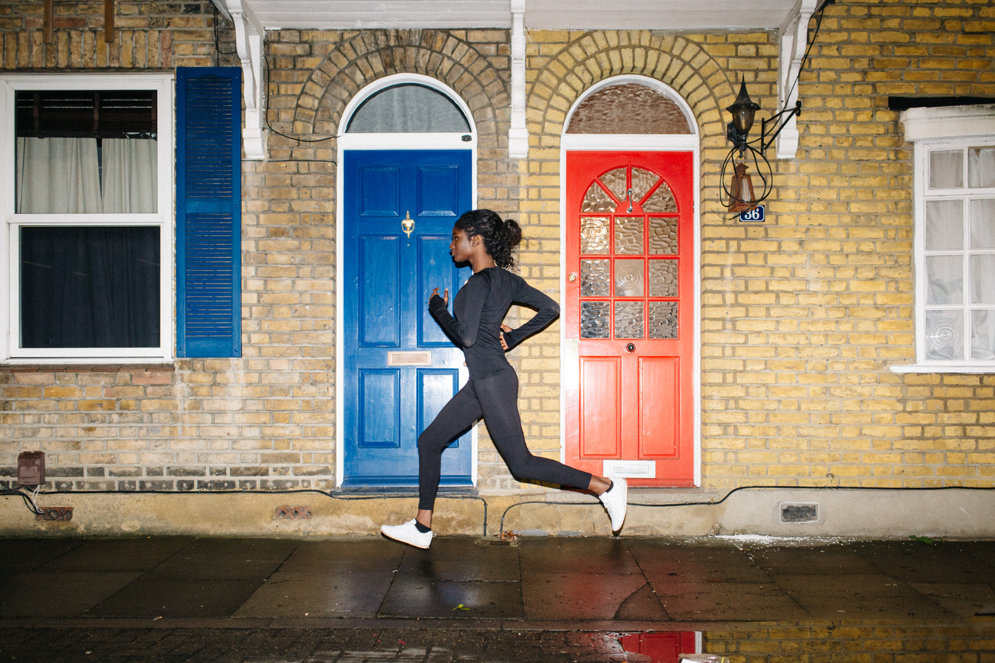 Ethnic woman running at night