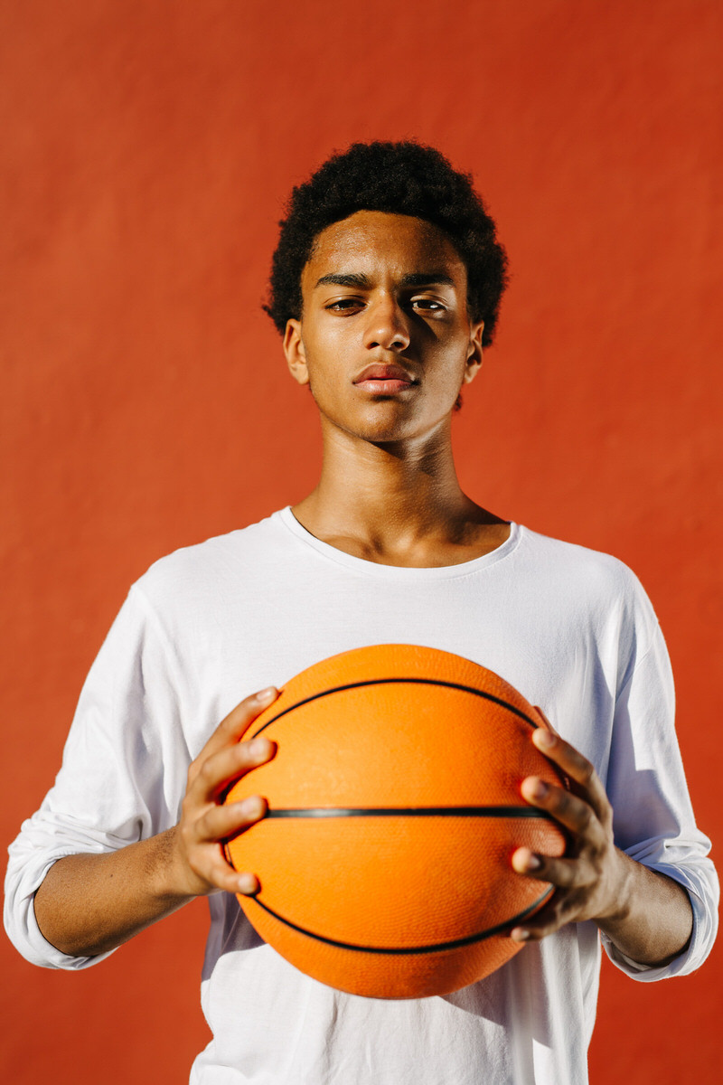 Confident black man with basketball