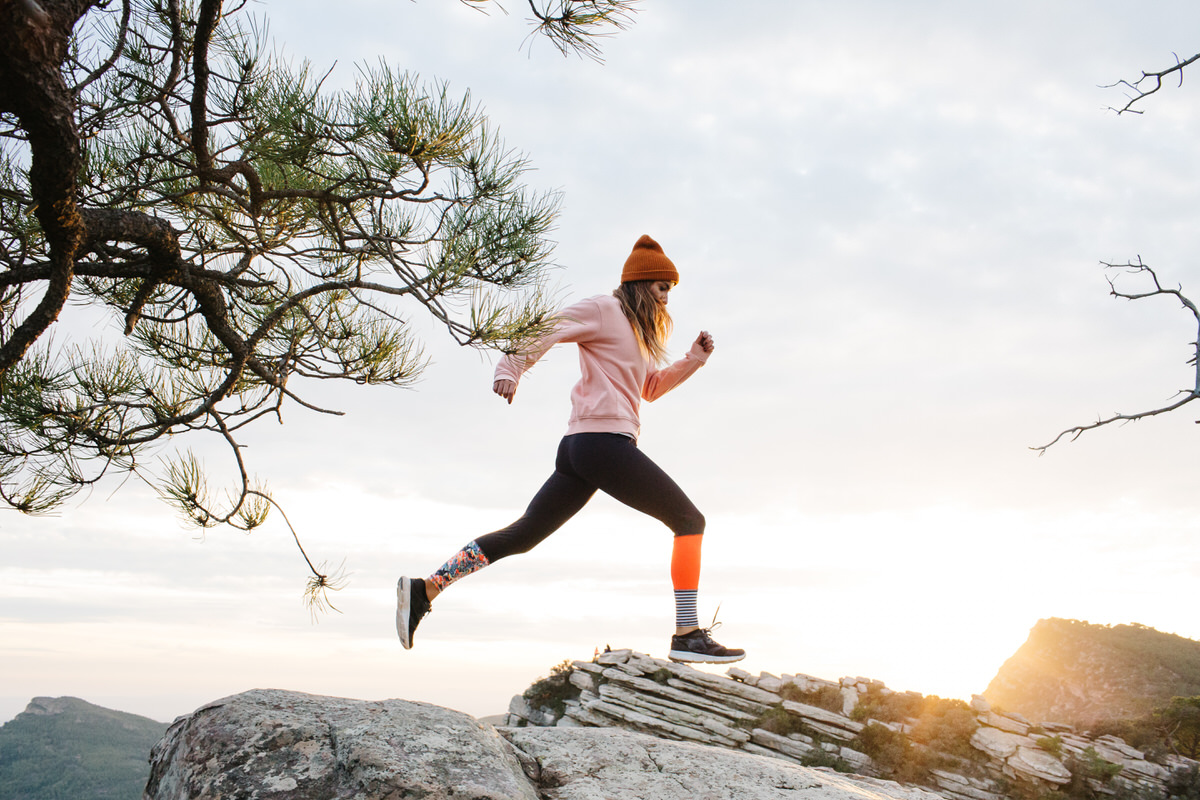 Woman jogging on hill
