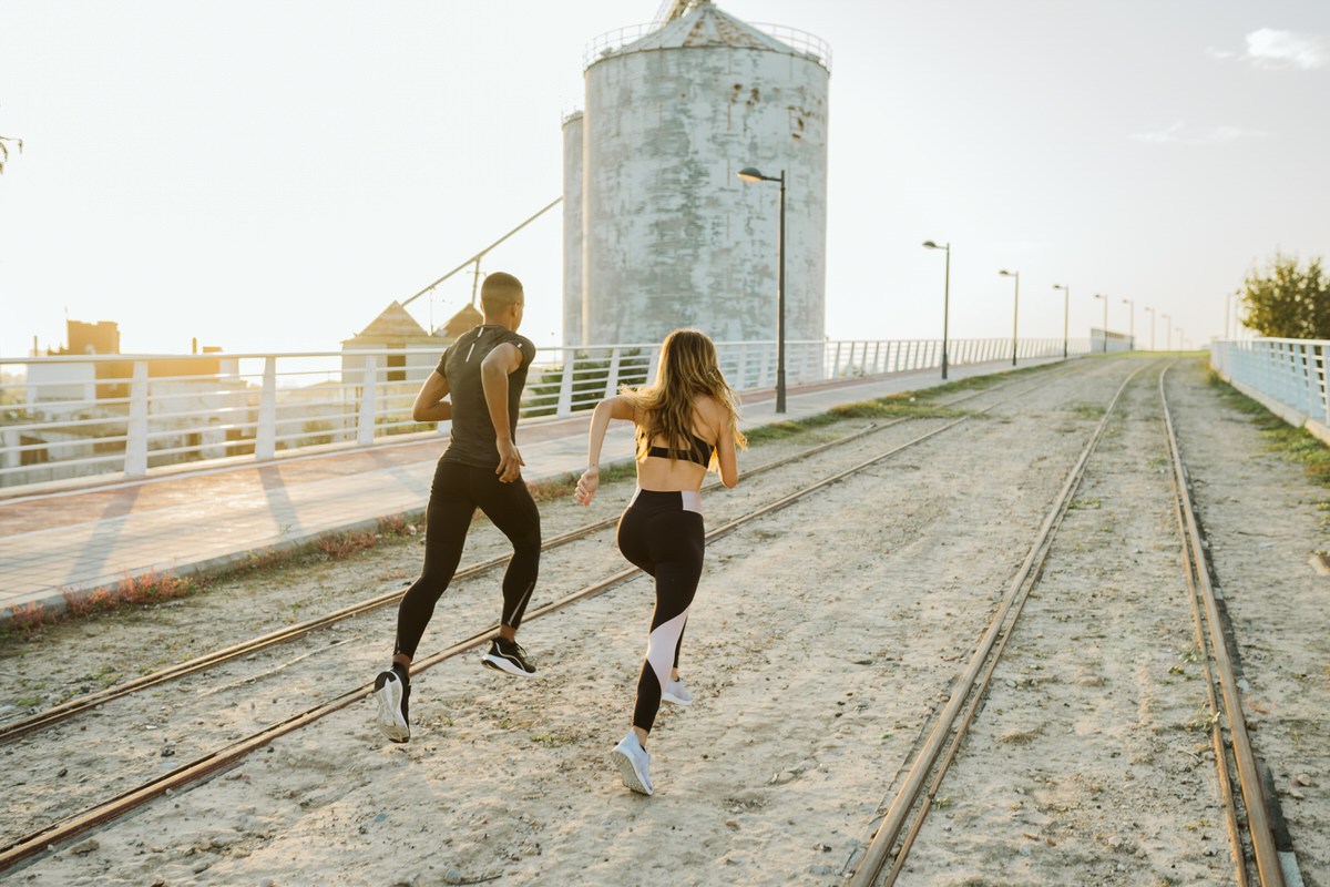 Strong people running on railroad