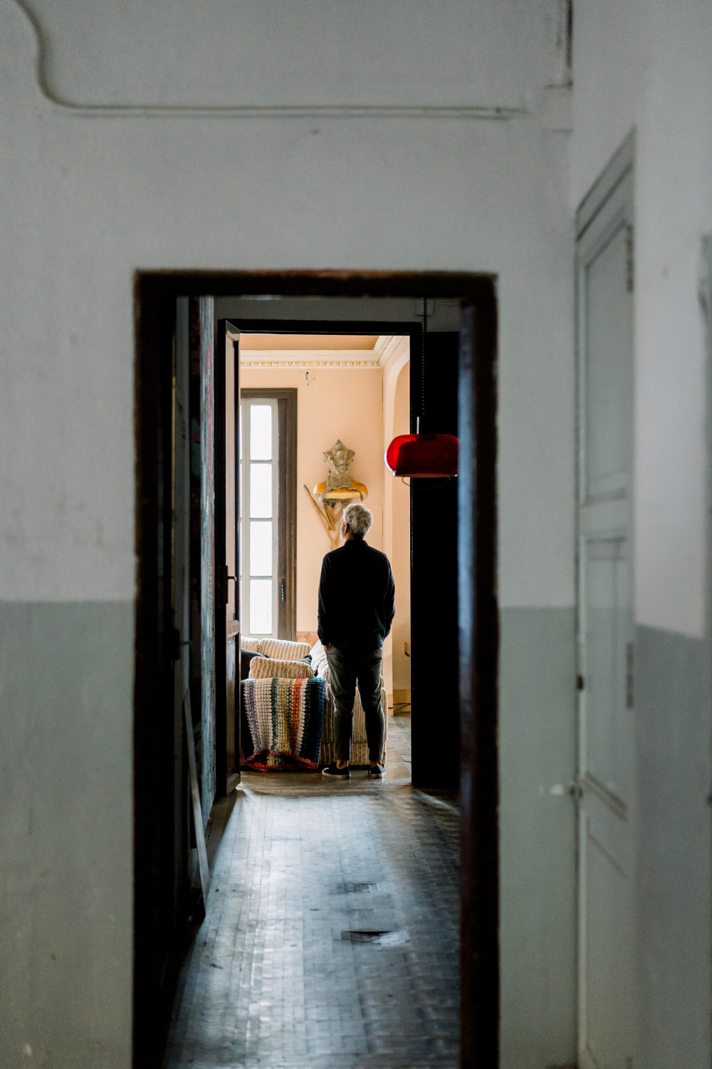 Anonymous man in aged apartment