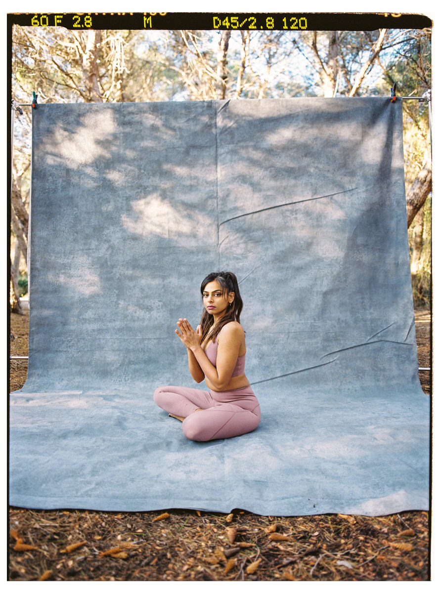 Woman doing yoga in plank pose in park