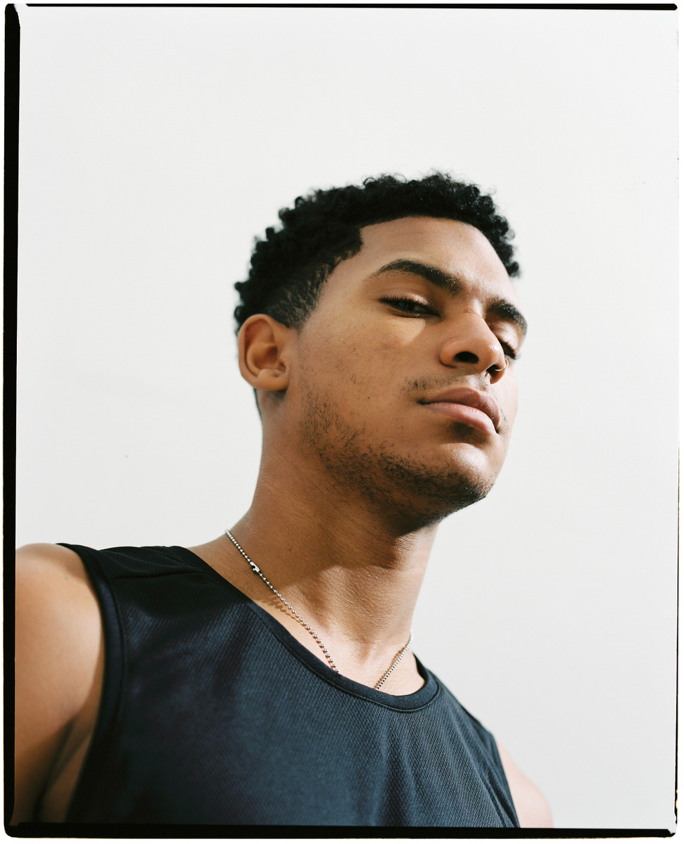 Serious black basketball player in studio