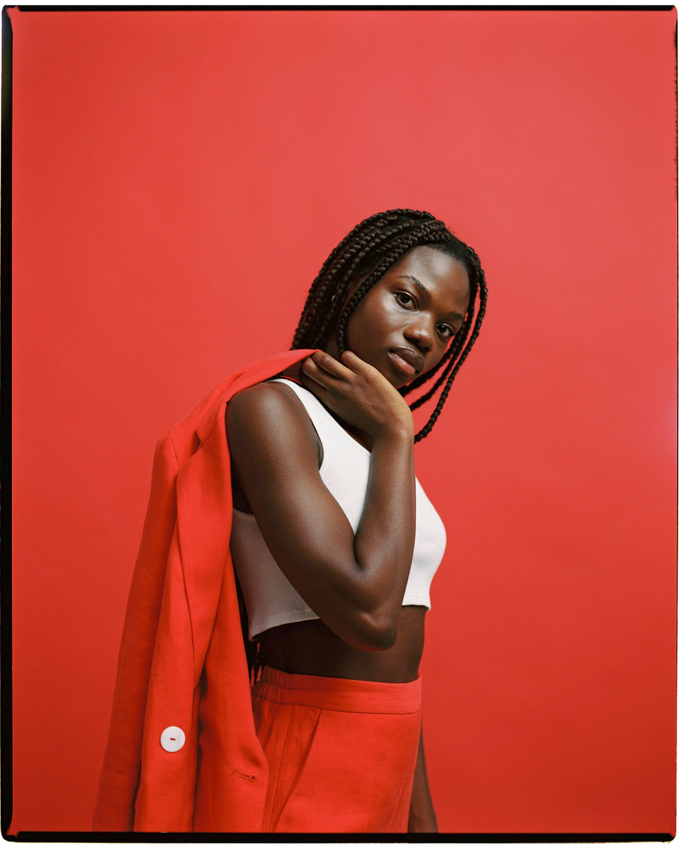 Black woman in classy red suit