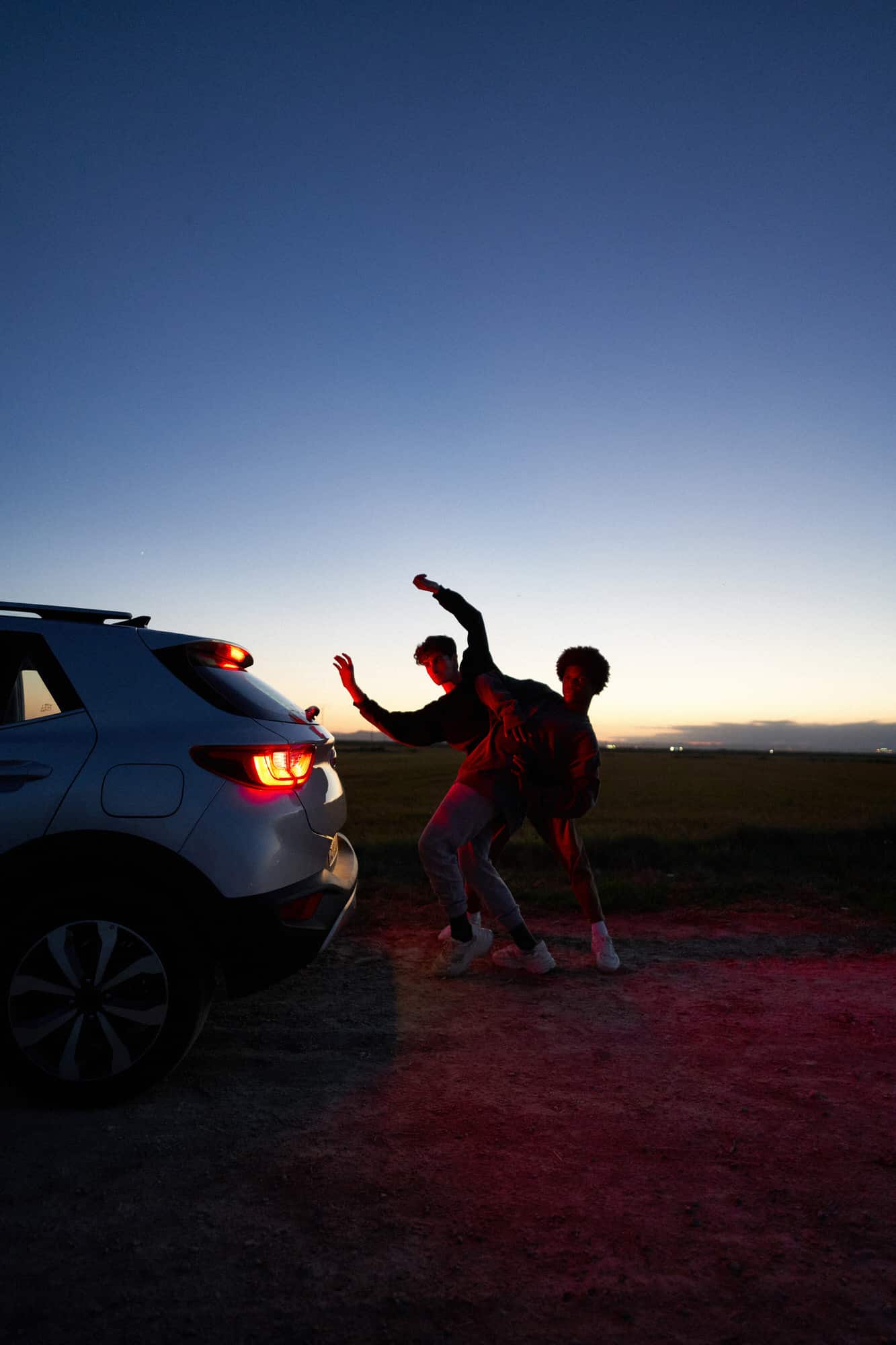 Diverse men dancing in evening