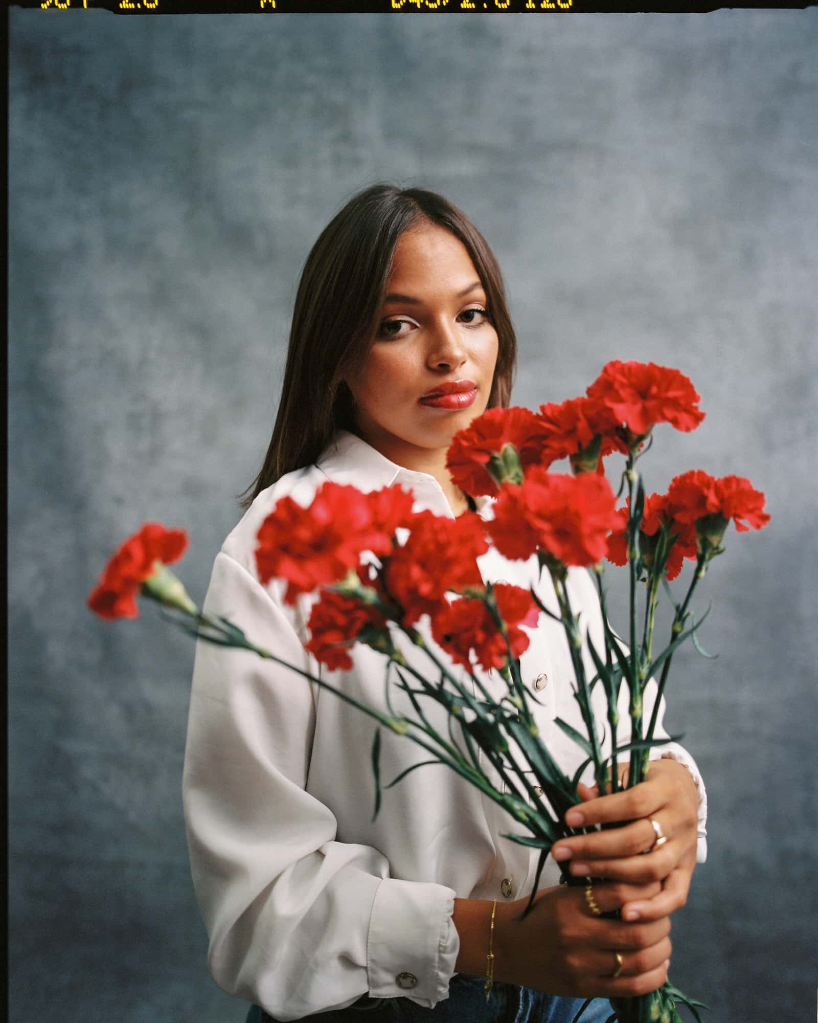 Stylish female model with flowers